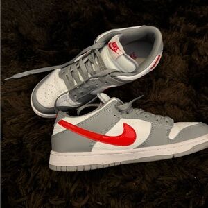 Nike Gray and White Shoes with Vibrant Red Logo